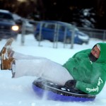 Isa Ortiz sleds at Fairchild Park after the snow storm Dec. 27.
