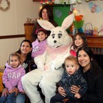 From left, Jordyne Almeida, 5, Ivone Almeida, Courtnie Almeida, 8, Shelbe Almeida, 13, Taylor MacDonald, 4, Karla MacDonald, and Ryan MacDonald, 2, pose for a picture with the Easter Bunnry at the Naugatuck Parks and Recreation Department's Easter Village April 22.
