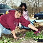Naugatuck Historical Society President Wendy Murphy, left, and Sondra Harman of the Naugatuck River Revival Group, plant flowers donated by Flowers Plus outside the Historical Society Museum as part of Earth Day efforts April 22.