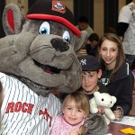 From left, Gracie Roberts, 3, Luke Roberts, 10, and Mariah Miklus, 13, pose with Rocky of the New Britain Rock Cats.