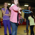 Emily Dyer, 9, tries to “Ring a Run” at Maple Hill math night.