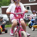 Abigail Brink peddles around the parking lot of Tender Years Preschool in Naugatuck during the annual Trike-a-Thon May 20.