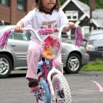 Hannah DeCampos peddles around the parking lot of Tender Years Preschool in Naugatuck during the annual Trike-a-Thon May 20.