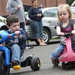 James Korowotny, left, and Alivia Stewart trike around the parking lot of Tender Years Preschool in Naugatuck during the annual Trike-a-Thon May 20.