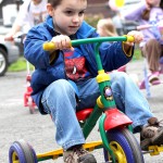 Justin Perriera peddles around the parking lot of Tender Years Preschool in Naugatuck during the annual Trike-a-Thon May 20.