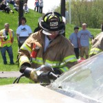 KYLE BRENNAN Woodland student Cal Brennan works to cut apart one of the cars used in a mock crash May 11. Brennan organized the mock crash for his senior project.