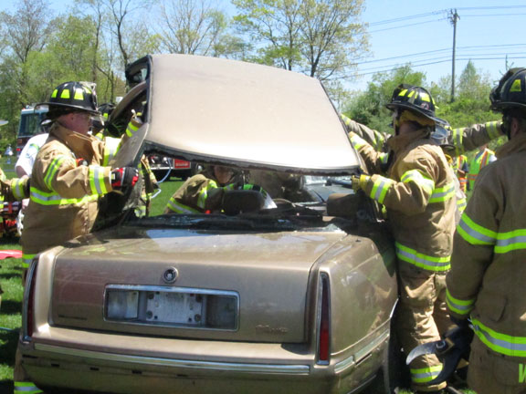 A victim is extricated from his car during a mock crash demonstration staged at Woodland Regional High School.
