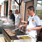 Jeremy Rodorigo, public information officer for the Beacon Hose Co. No. 1, mans the grill during the 4th annual Naugatuck Valley River Race and Festival May 7. PHOTO BY ELIO GUGLIOTTI