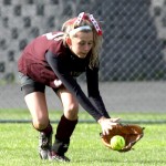 Naugatuck's Melissa LaBonte goes for a grounder during the Hound's match against Crosby May 9.