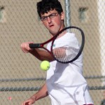 Naugatuck's Jake Burrel reaches for the ball during a doubles match against Crosby May 9. - PHOTO BY LARAINE WESCHLER