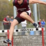 Naugatuck's Colton Wagner clears a hurdle during Naugatuck's home track meet May 5. - PHOTO BY LARAINE WESCHLER