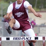 Naugatuck's Andres Jiminez clears a hurdle during Naugatuck's home track meet May 5. - PHOTO BY LARAINE WESCHLER
