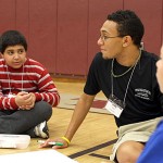 Anthony Rodrigues, left, discusses leadership with Fred Carter, right during a leadership conference at Naugatuck High School.