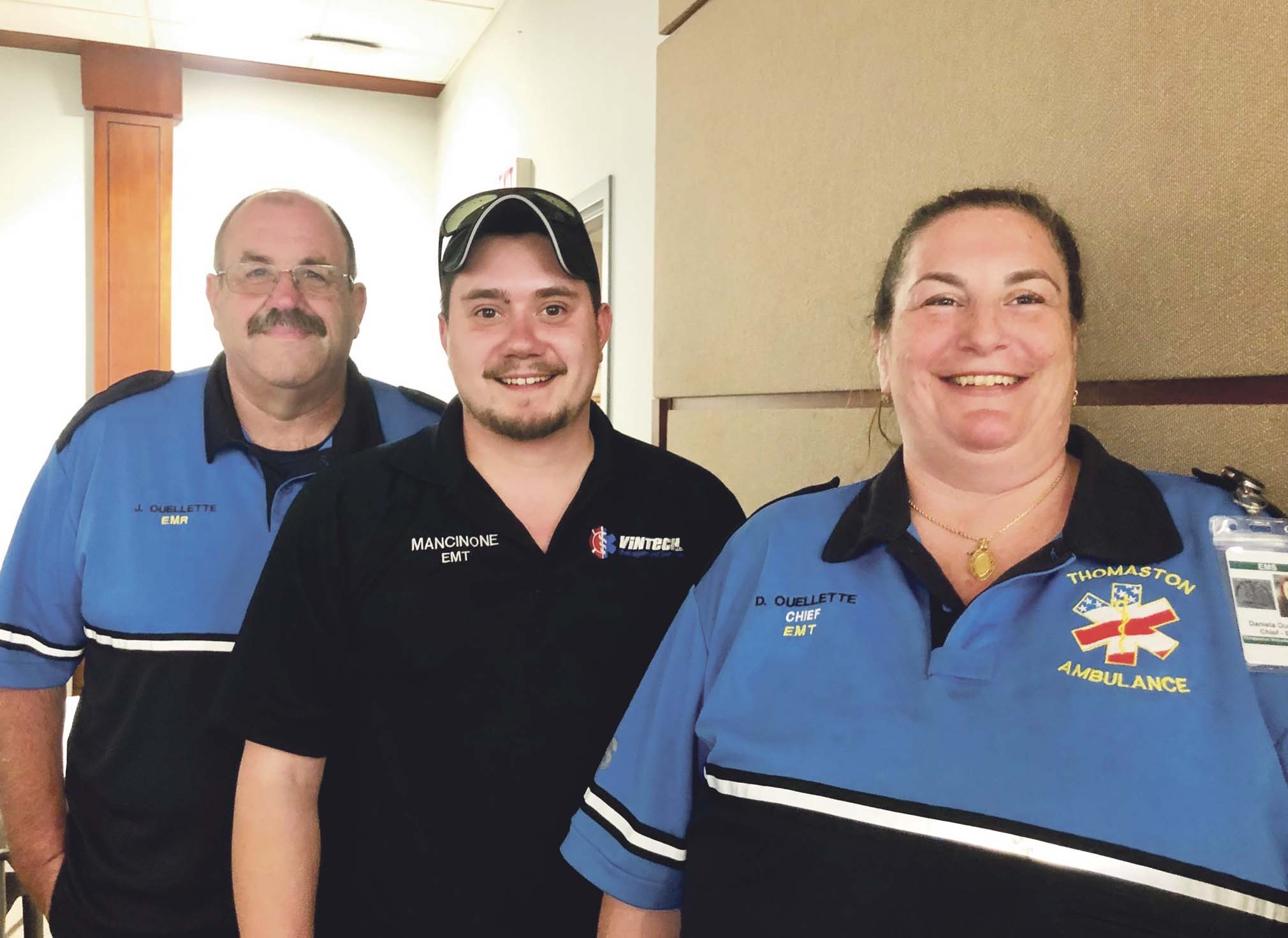 Thomaston EMTs, from left, Joe Ouellette, Tom Mancinone and Daniela Ouelette, who worked together to resuscitate a lifeless baby, are recognized by Waterbury Hospital on Wednesday night. Steve Bigham Republican-American